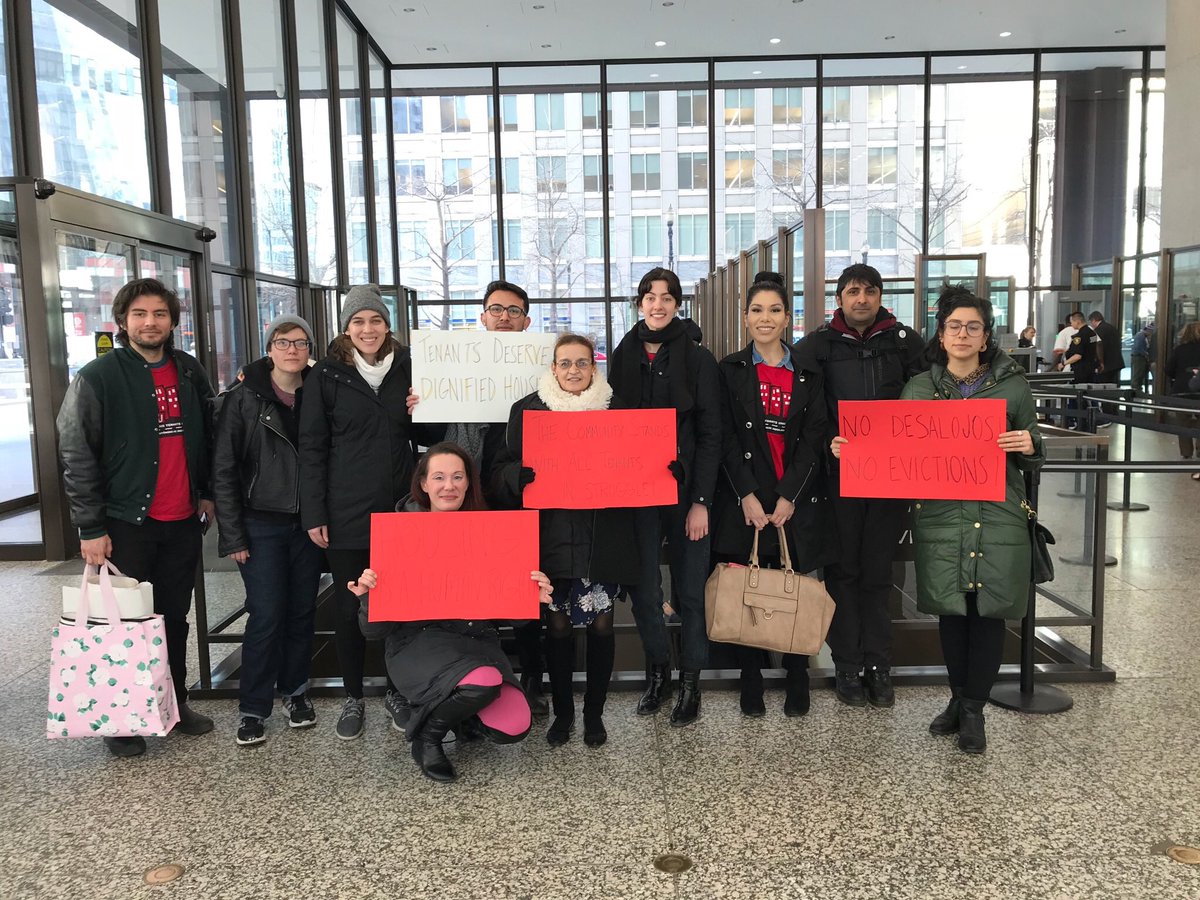 OCAD people with signs in courtroom lobby in support.